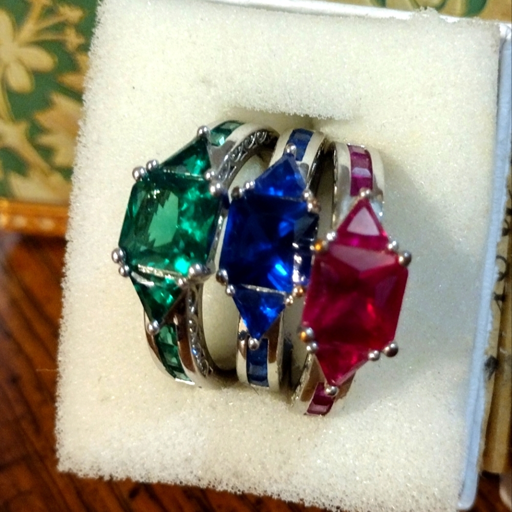 Emerald, sapphire, and ruby rings